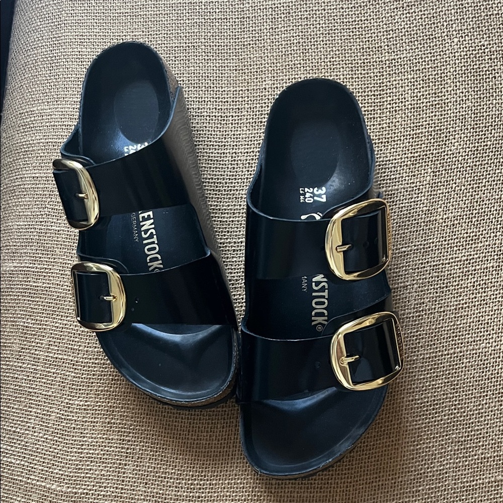 Birkenstock Arizona Glossy Black Sandals with Gold Accents